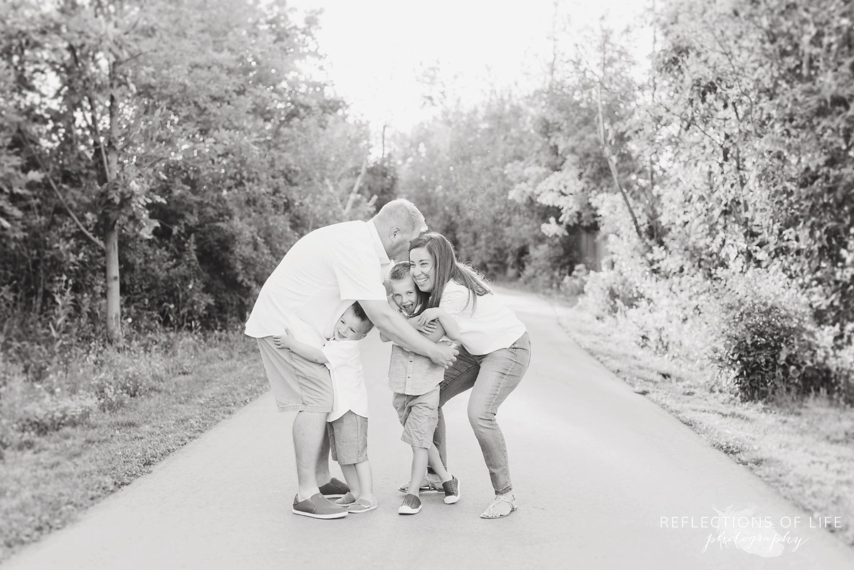 family hugging in black and white