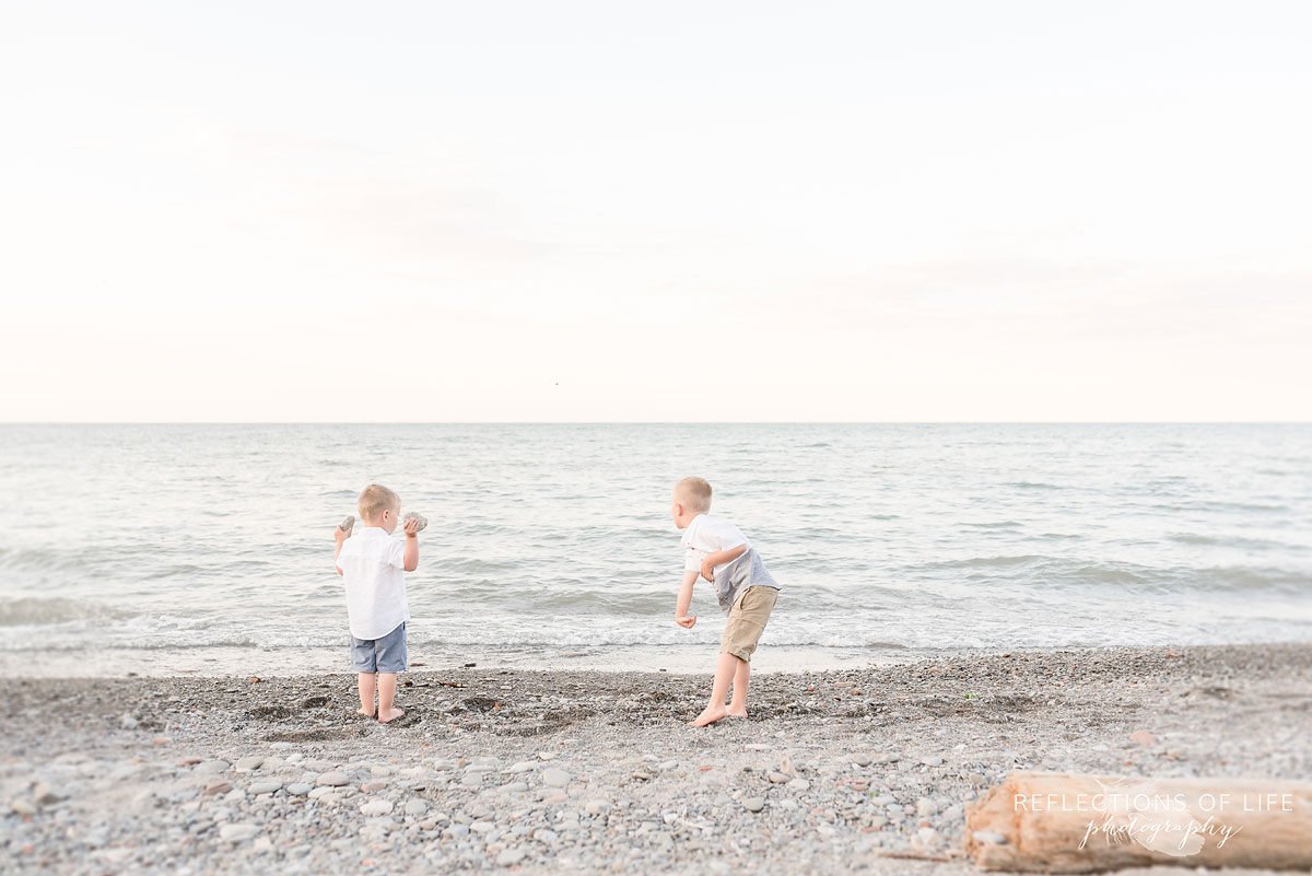 Two boys playing at the beach in Grimsby Ontario