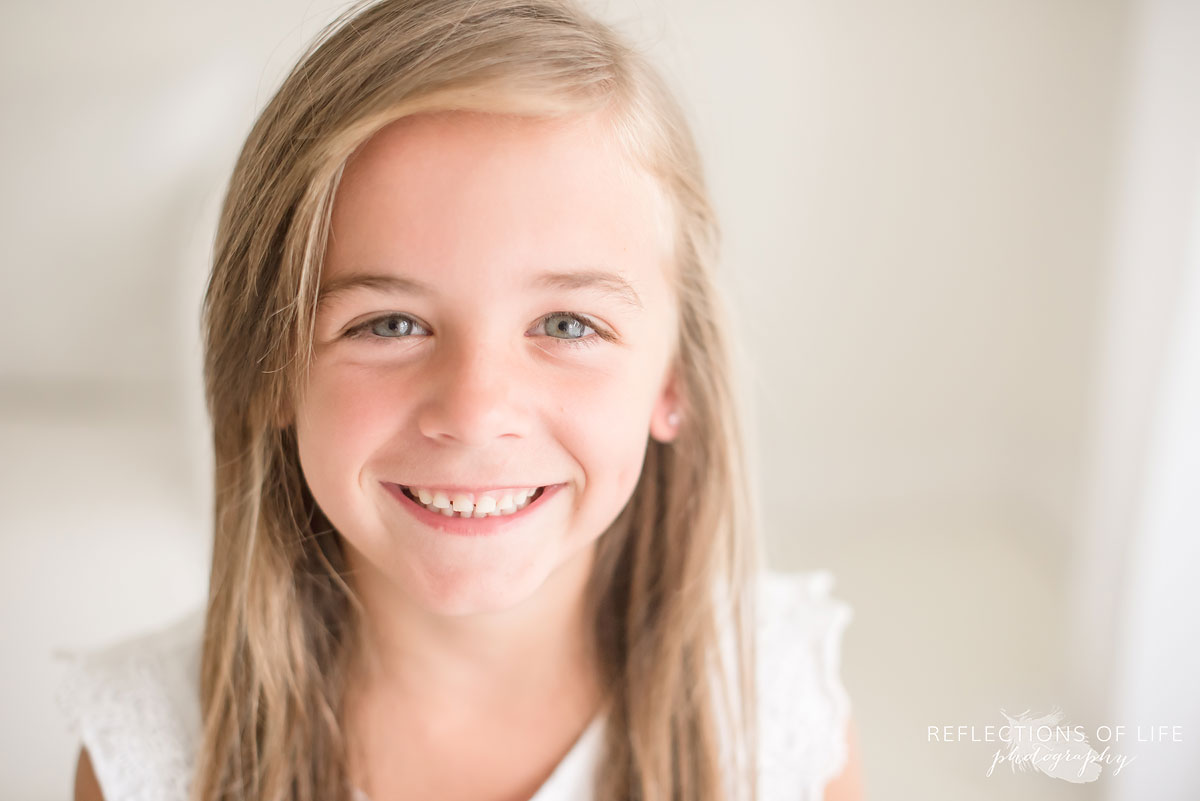 little girl smiling at the camera