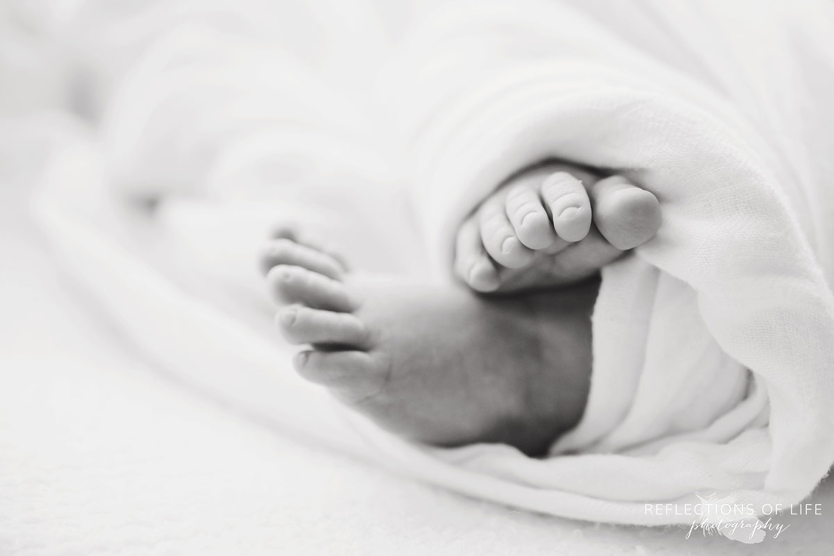 newborn baby boy toes in black and white