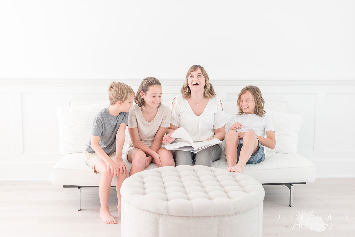 Karen Byker Pro Photographer in Niagara Ontario laughing with her kids.jpg