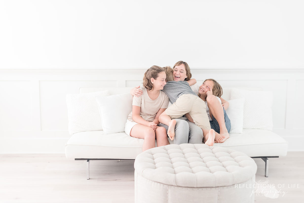 Big hugs between Karen Byker pro photographer and her youngest three kids.jpg