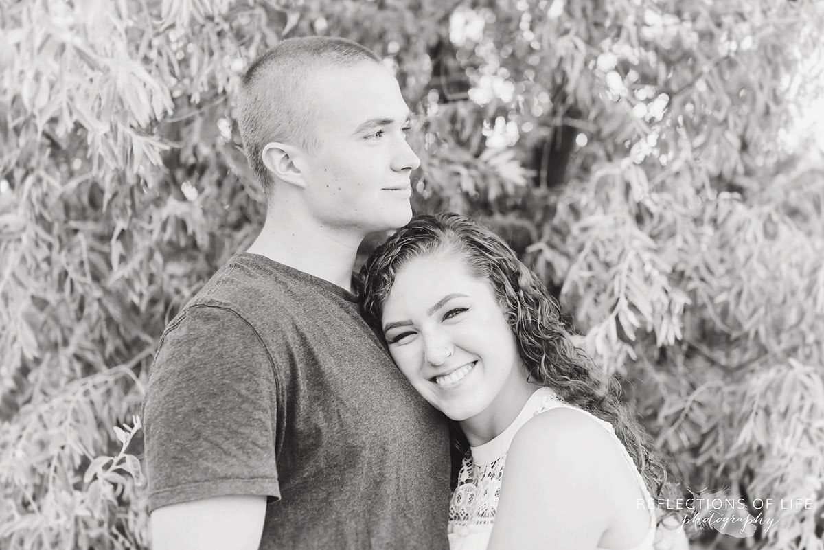 Girlfriend and boyfriend hugging on the beach