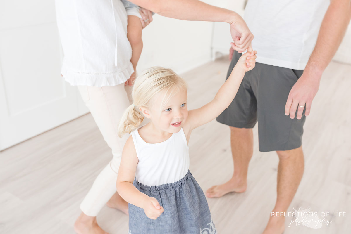 little girl dancing in Karen Bykers white studio