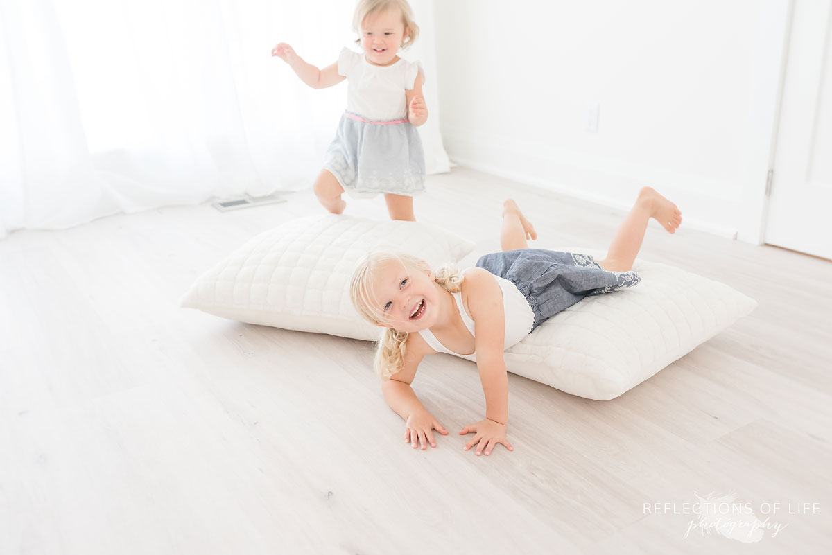 sister playing on pillow in Grimsby Ontario