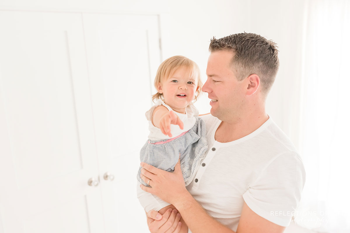 dad holding daughter in Niagara region