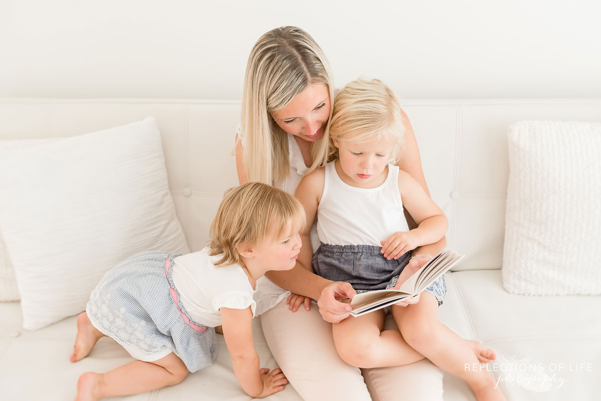 mother reading her daughters a story