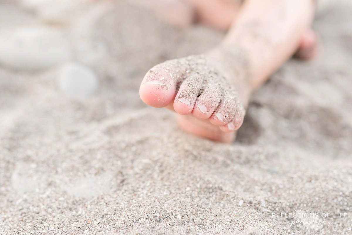 toes in the sand by Karen Byker
