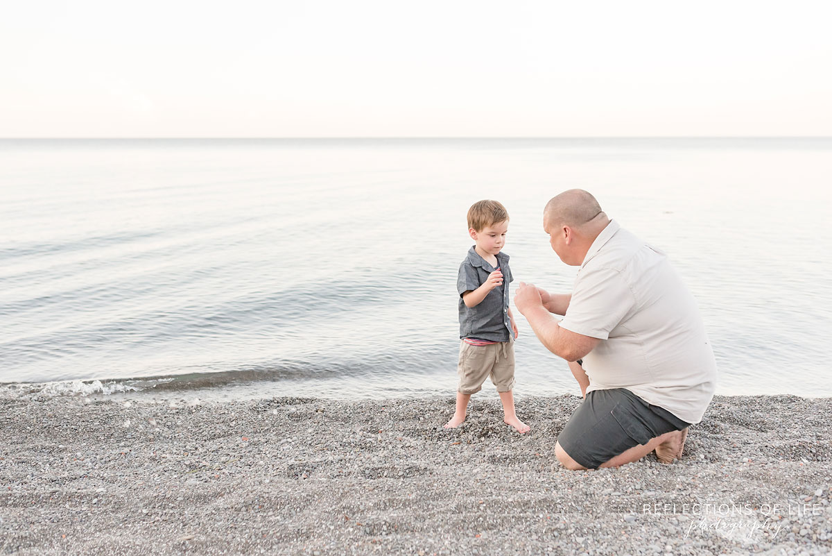 Father and son looking at each other in Grimsby Ontario