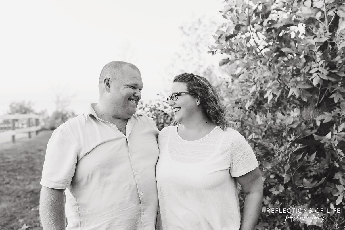 smiling couple looking at each other lovingly black and white