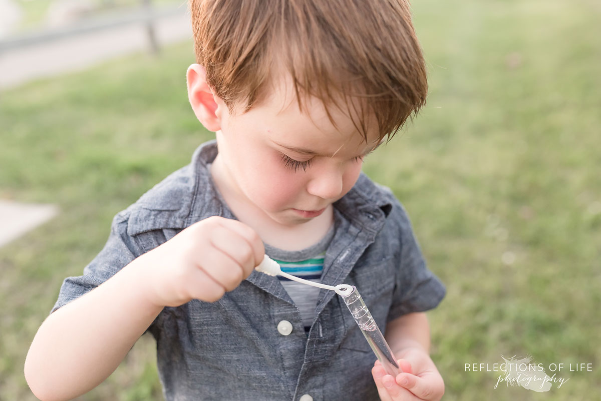 boy playing with bubbles