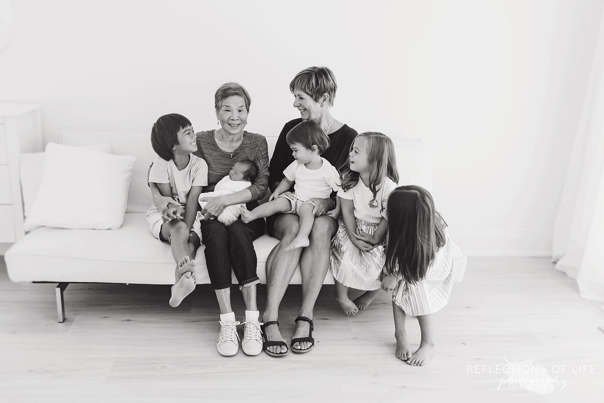 five grandchildren looking at grandmas black and white