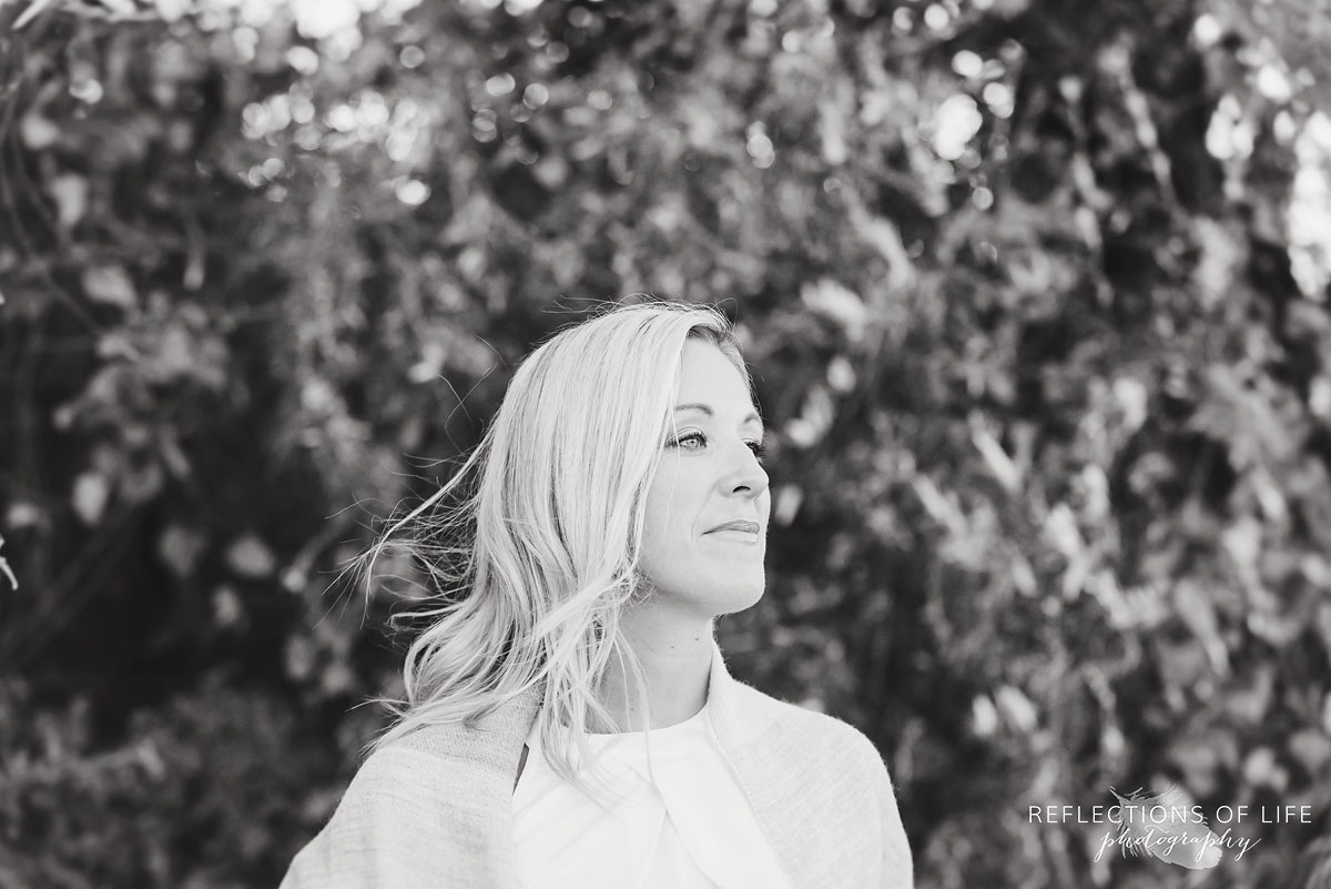 black and white of woman looking into the distance