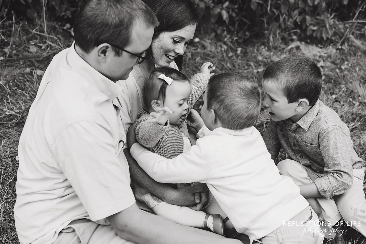 009 family black and white in field