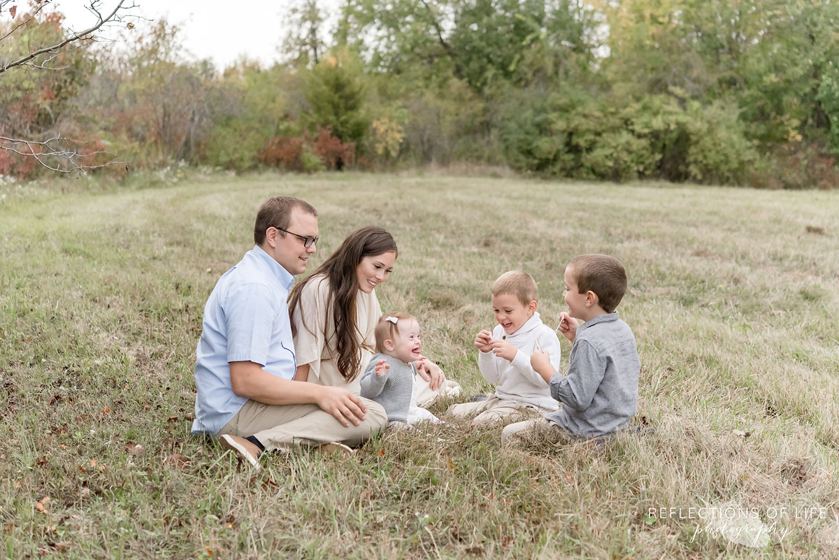 011 family lying in field