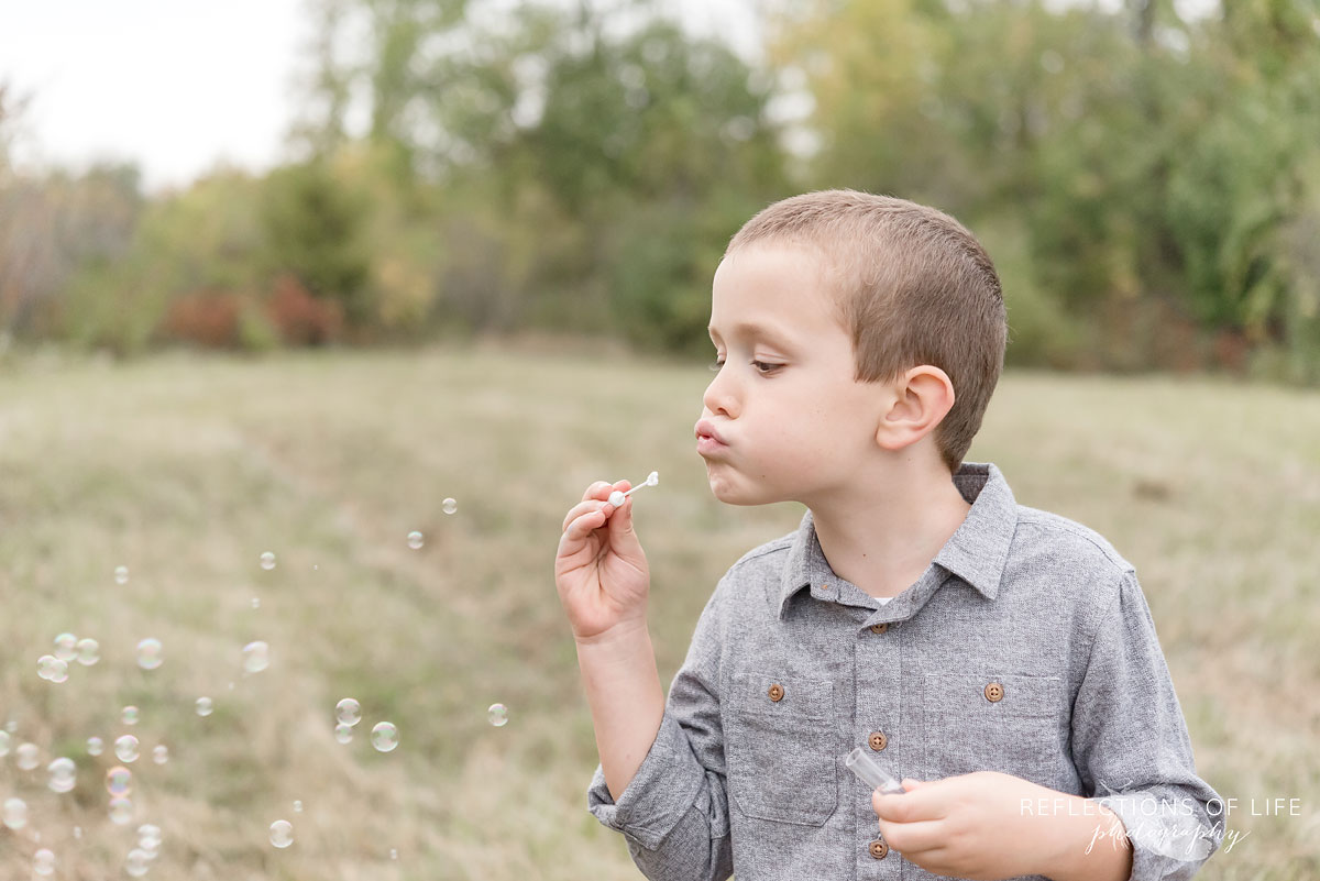024 boy blowing bubbles in Niagara Region