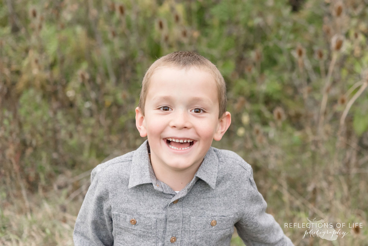 026 Young boy smiling at photographer Karen Byker