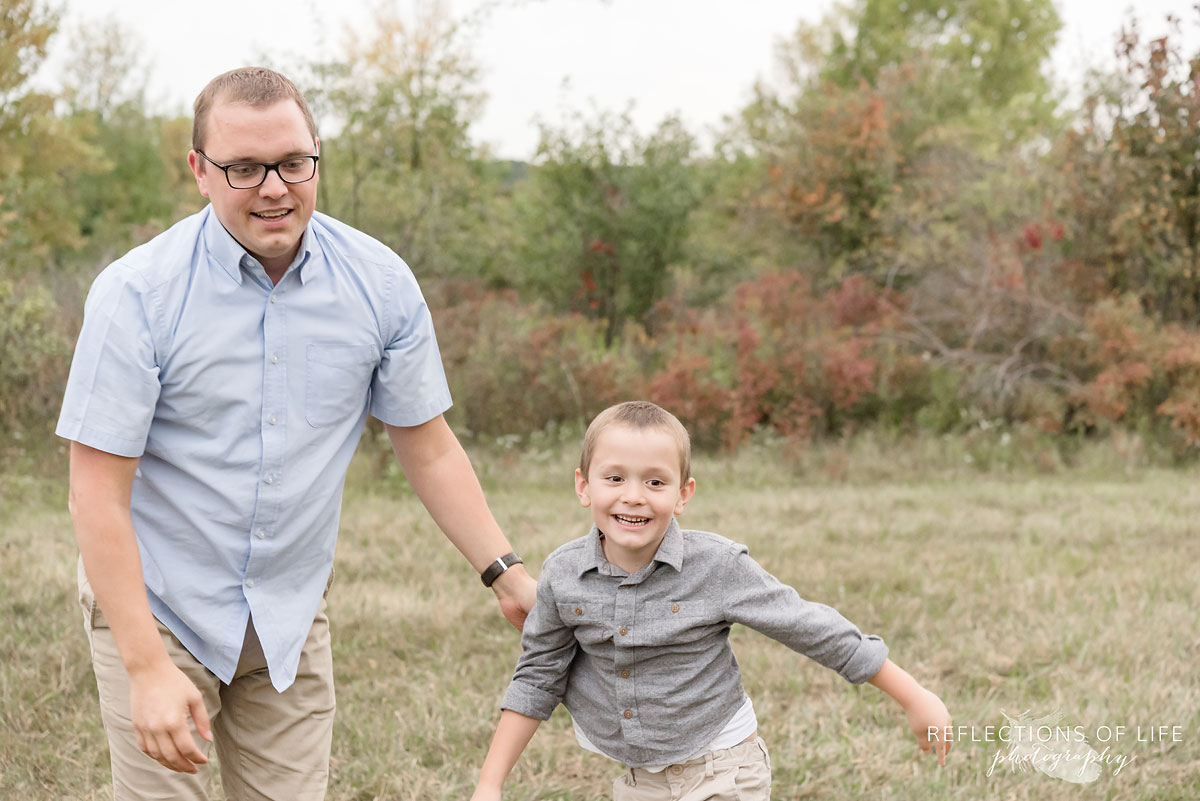 031 father and son running in field
