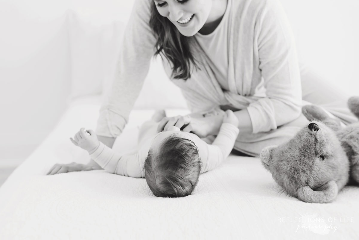mother and baby smiling