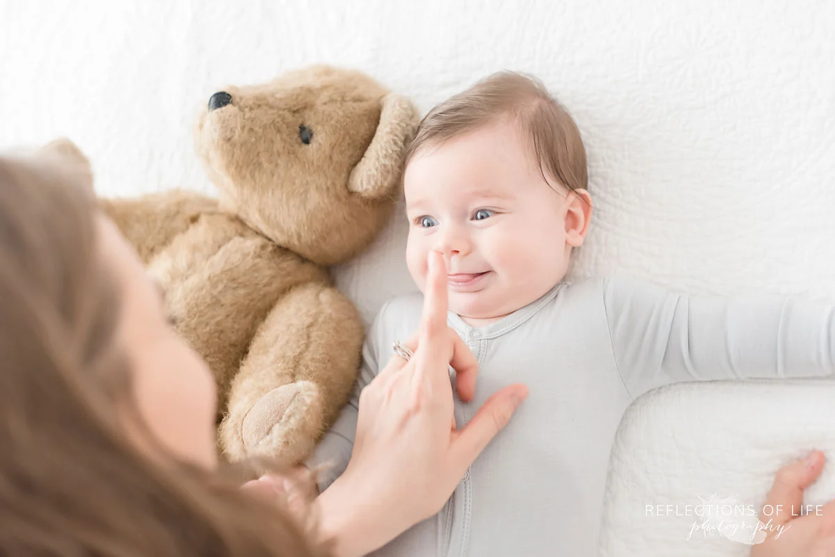 mother touching baby nose