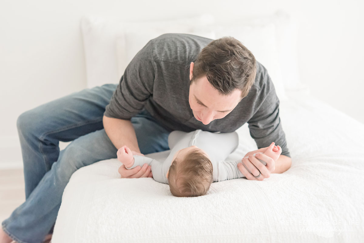 dad looking at baby