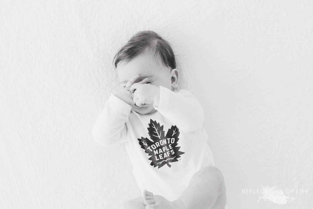 baby covering face