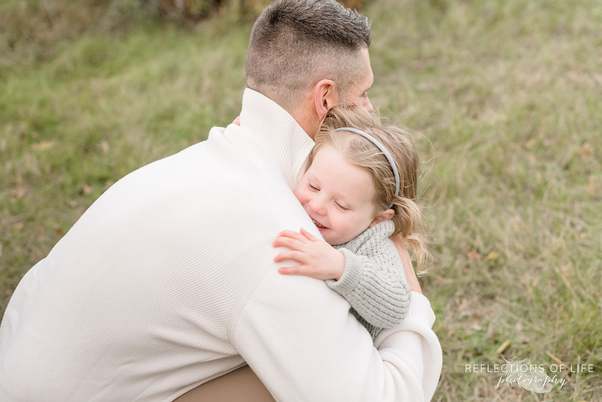 father and daughter hugging in niagara region