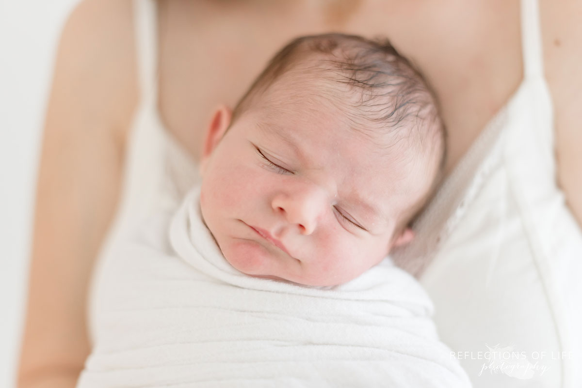 newborn in mamas chest