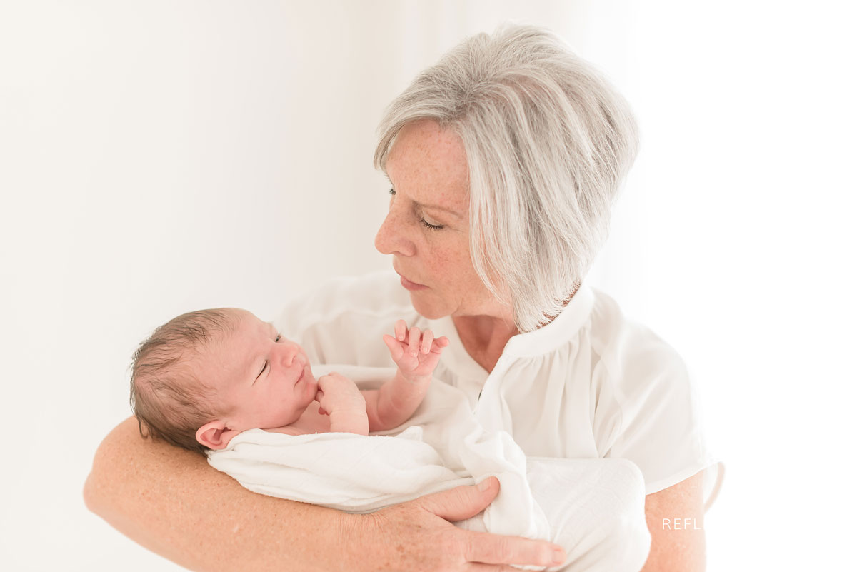 grandma holding newborn 