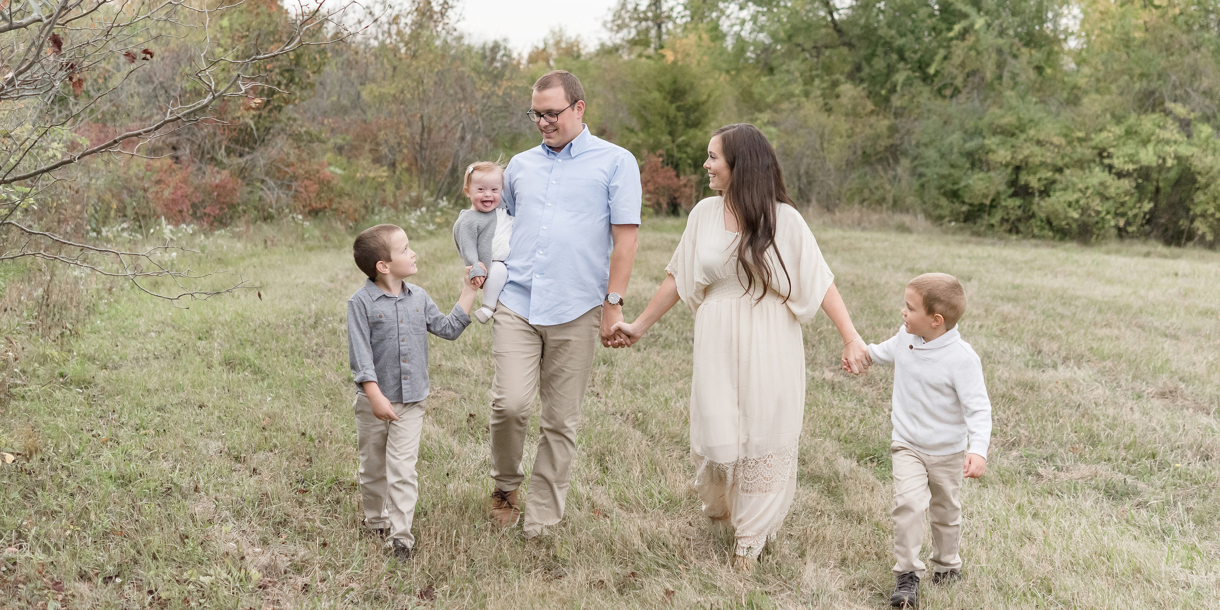 Family walking in field