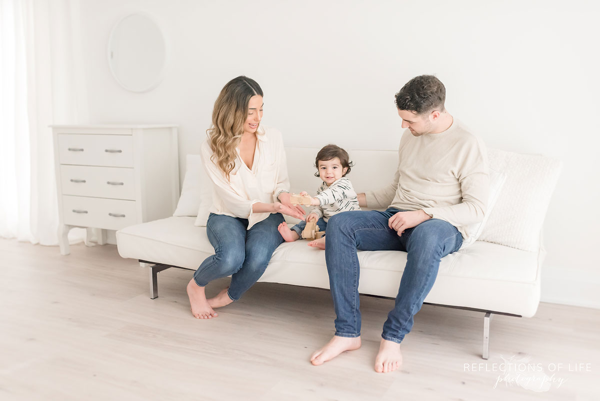 family on white couch