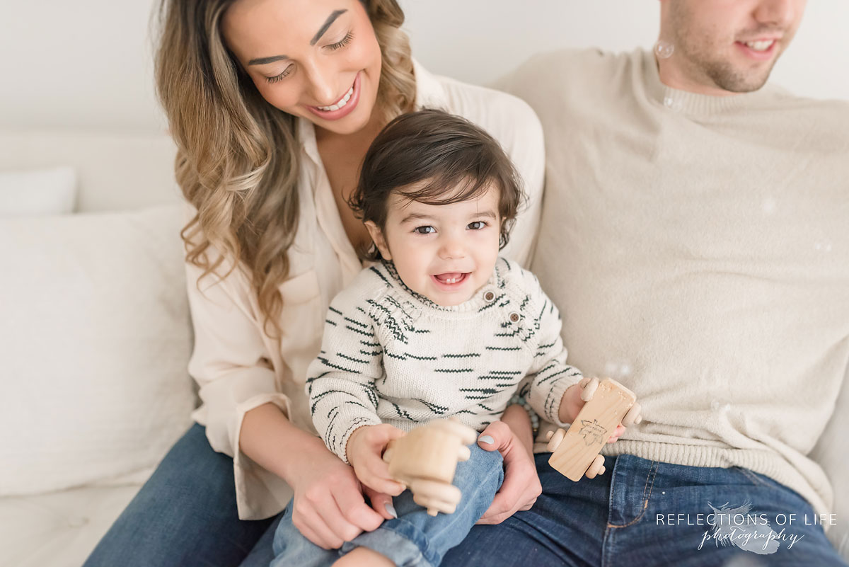 family on white couch in grimsby
