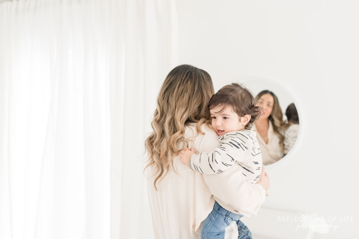 mother and child in mirror