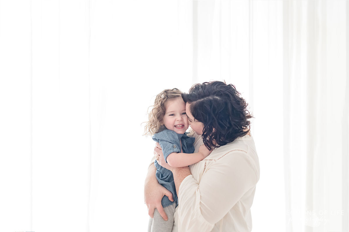 mother and daughter in white studio