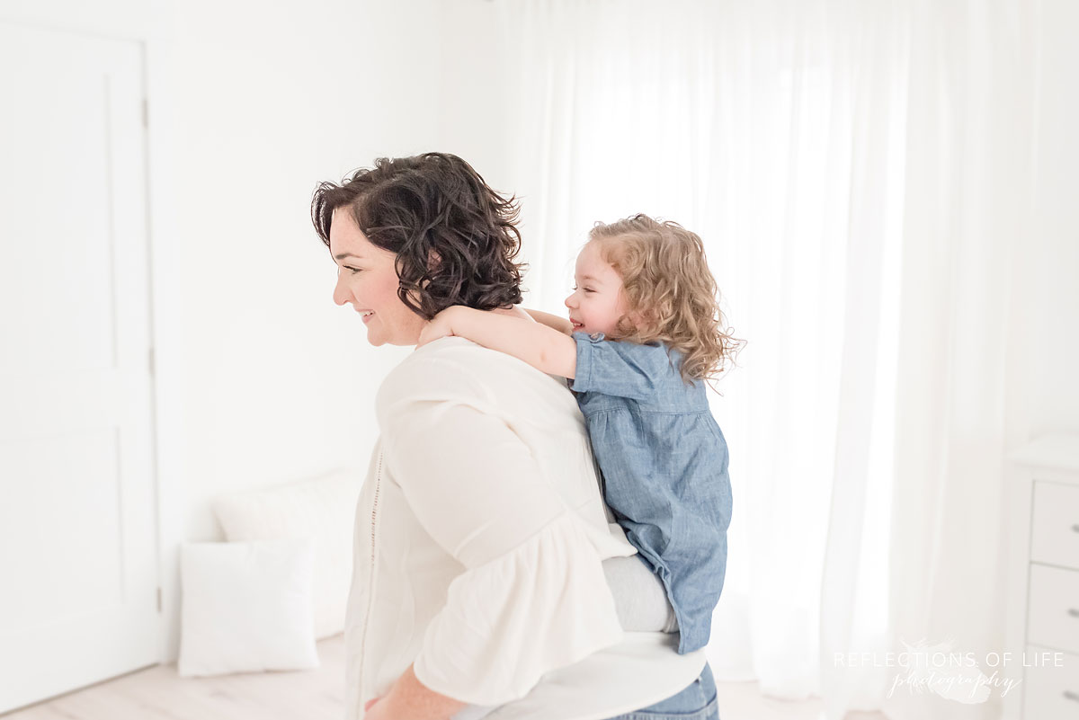 daughter holding on to mama