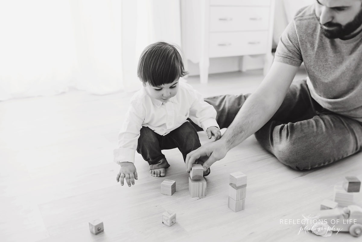 Father and son playing with blocks