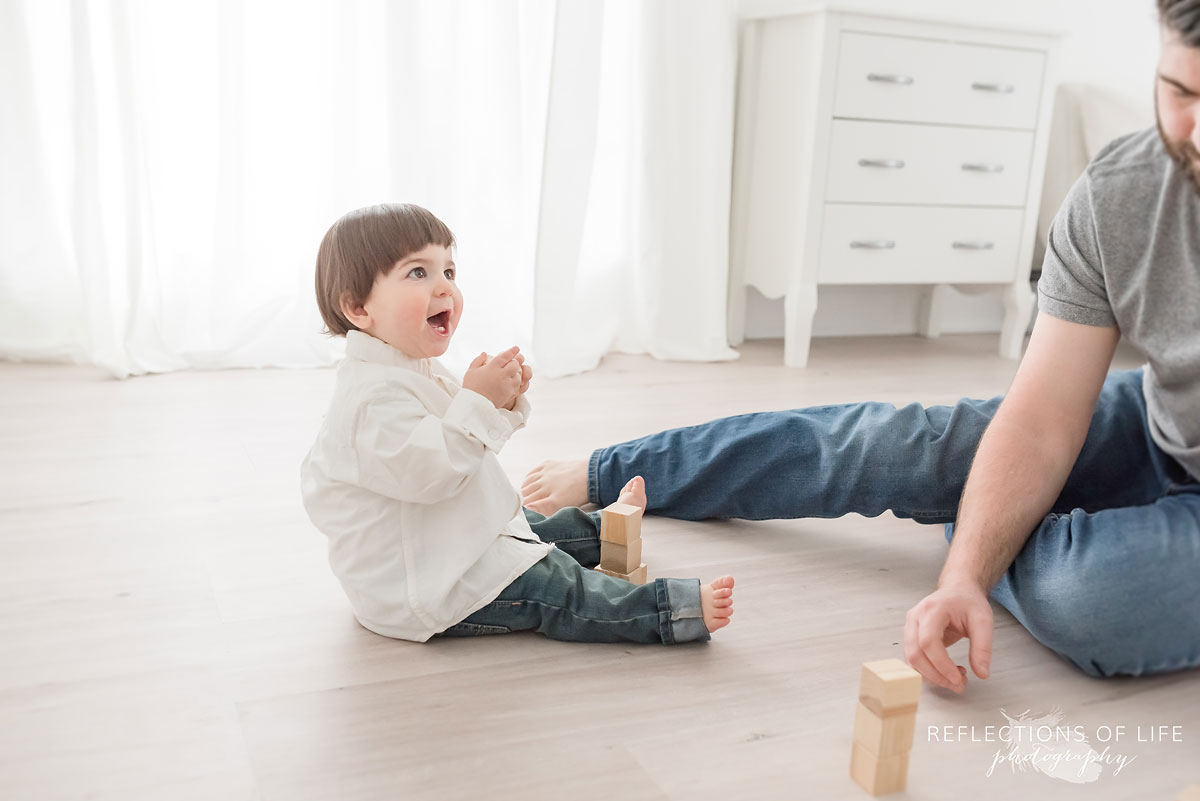 Son smiling at father
