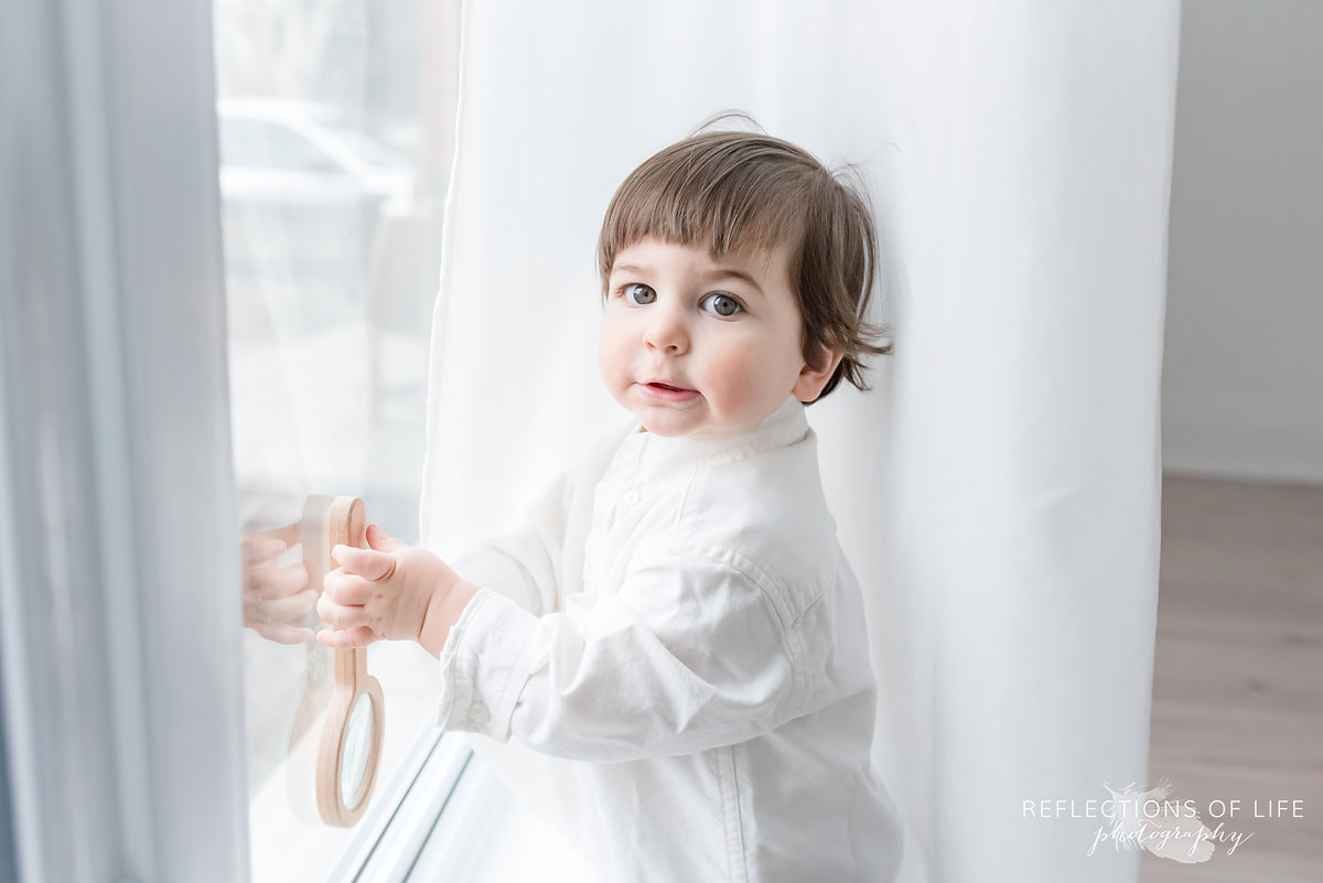 little boy looking out window