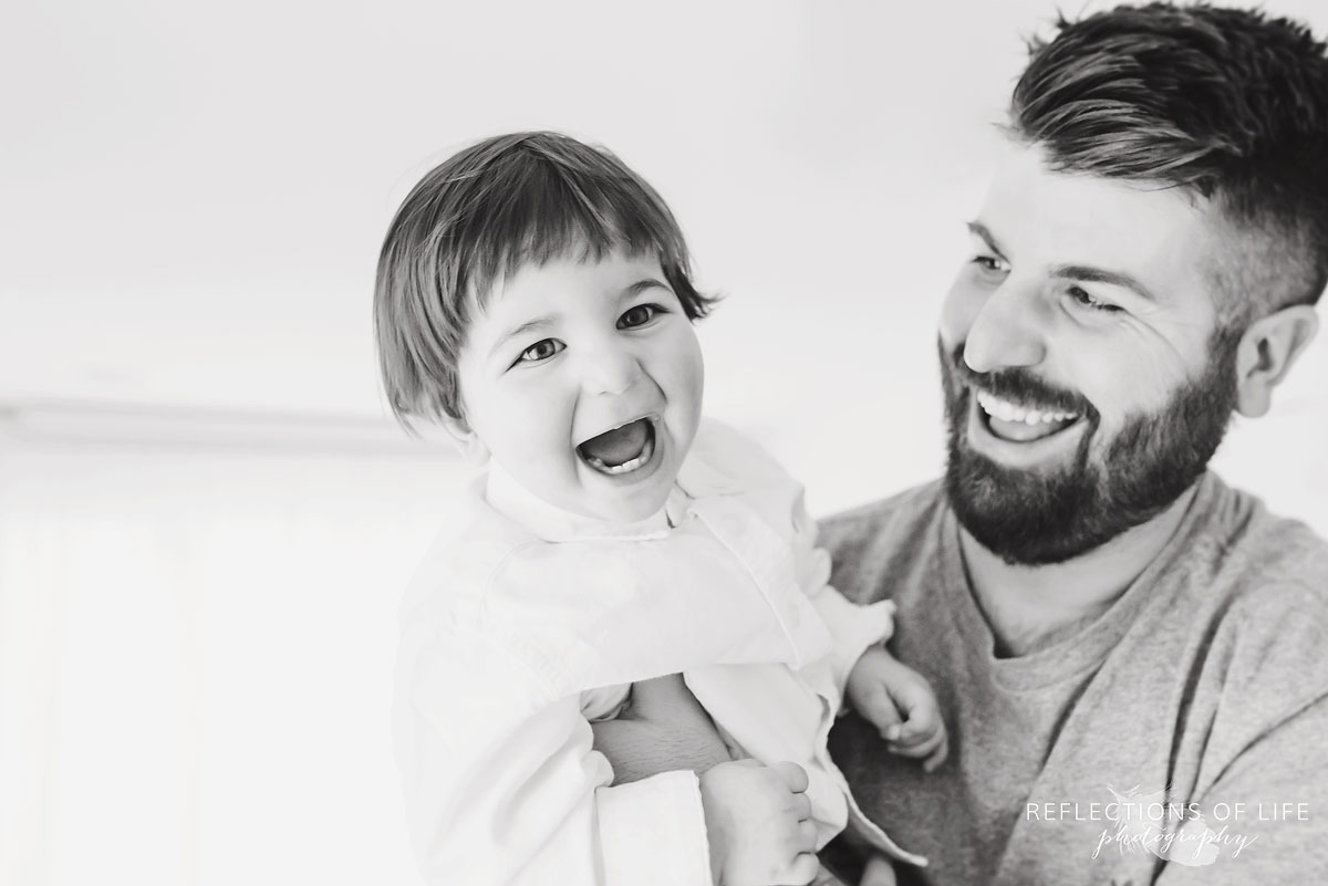 Father and son laughing