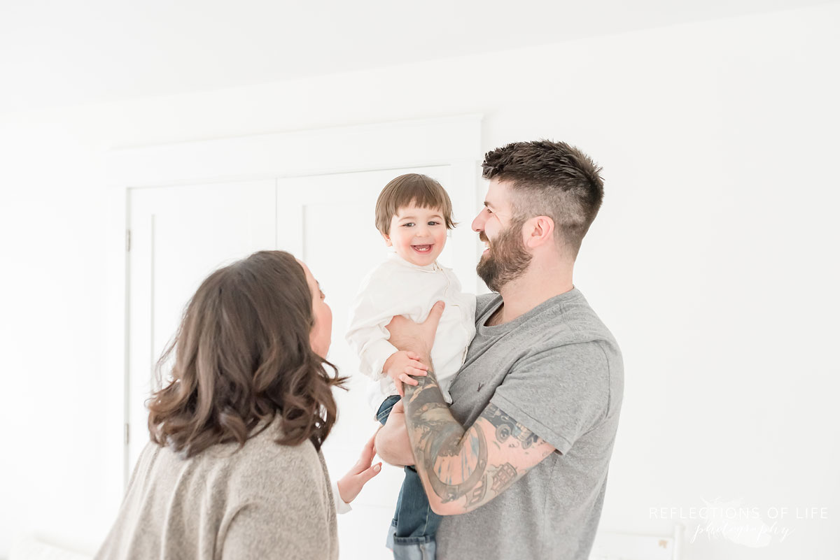 Family laughing in studio