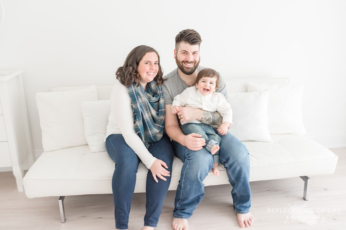 Family on white couch