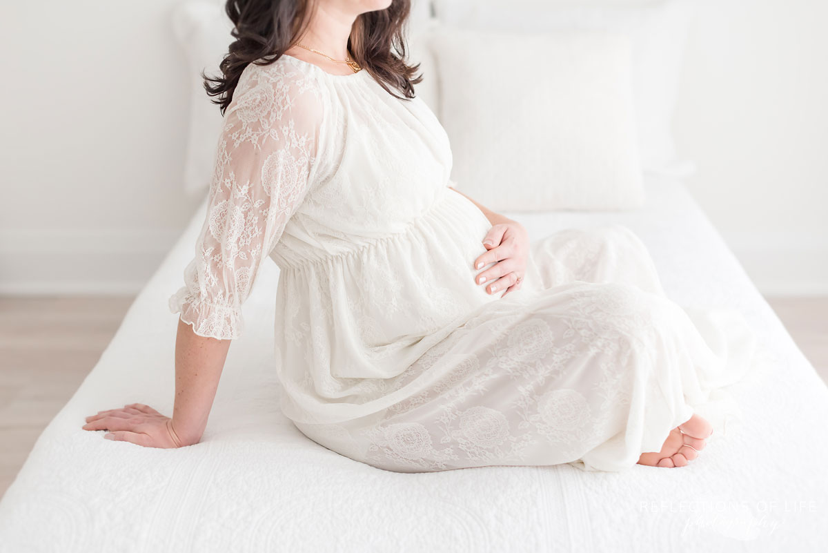 maternity shoot in white lace dress