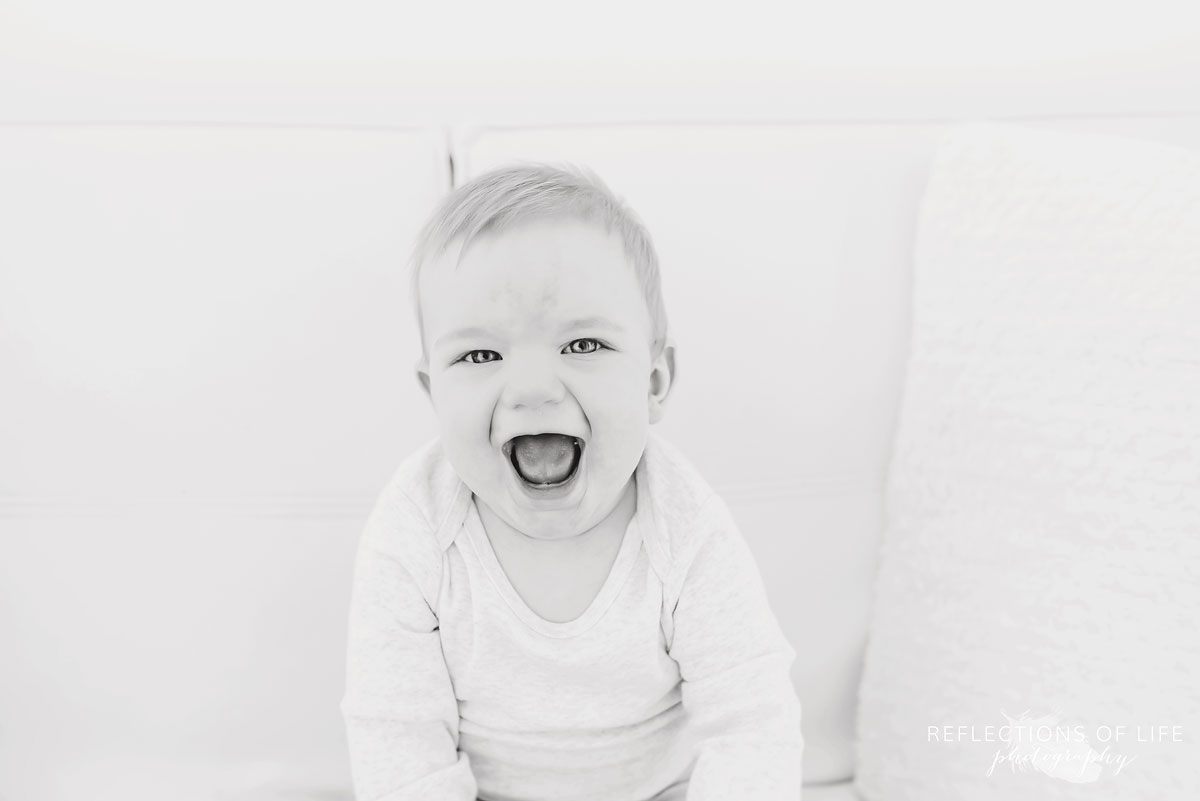 Copy of Copy of Little boy laughing in black and white