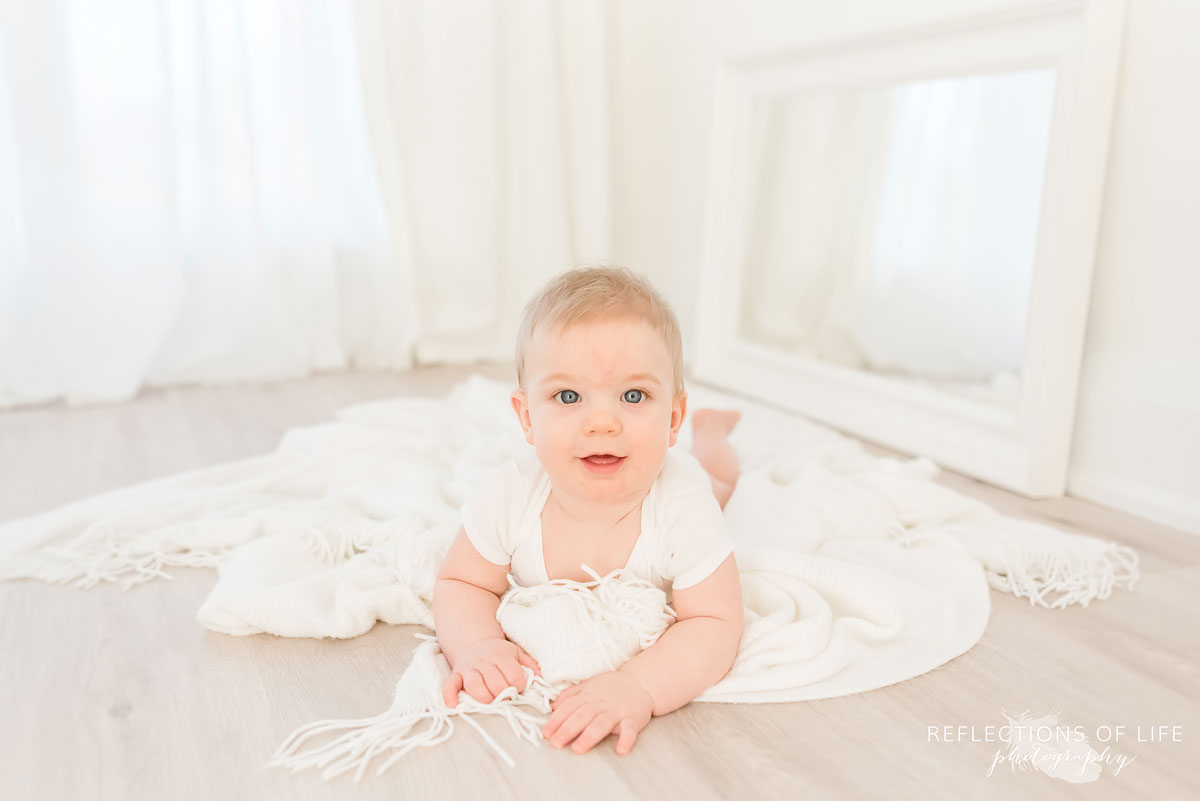 Copy of Copy of little baby boy Torin looking at the camera with a gentle smile