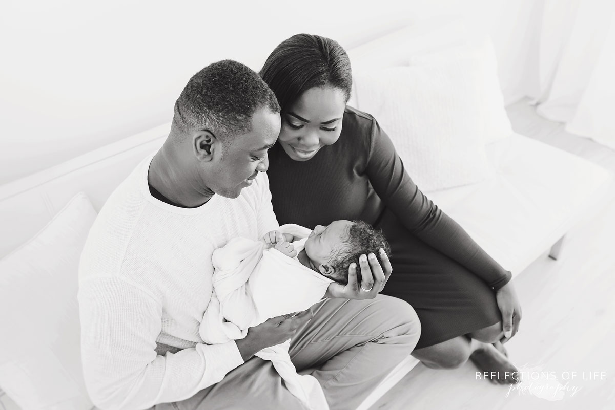 newbron baby boy with his mom and dad