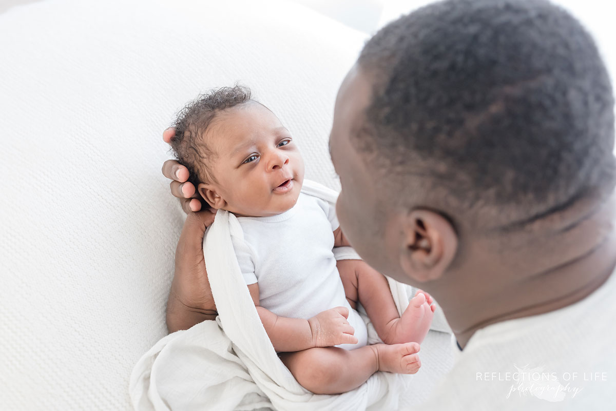 newborn baby boy in gerber onesie