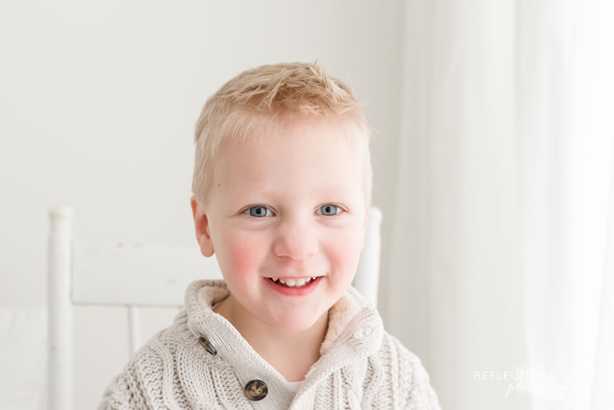 Portrait of little boy smiling at the camera.jpg
