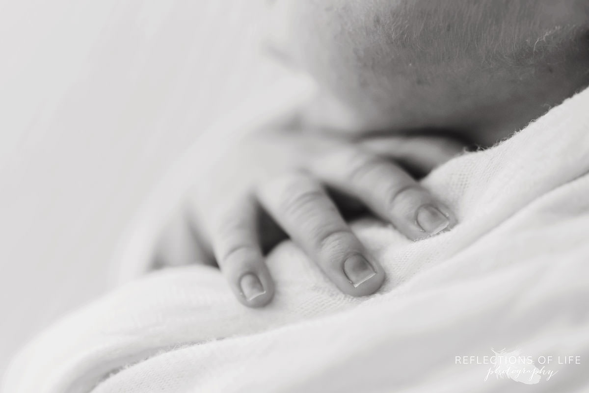Newborn baby fingers with close up lens.jpg