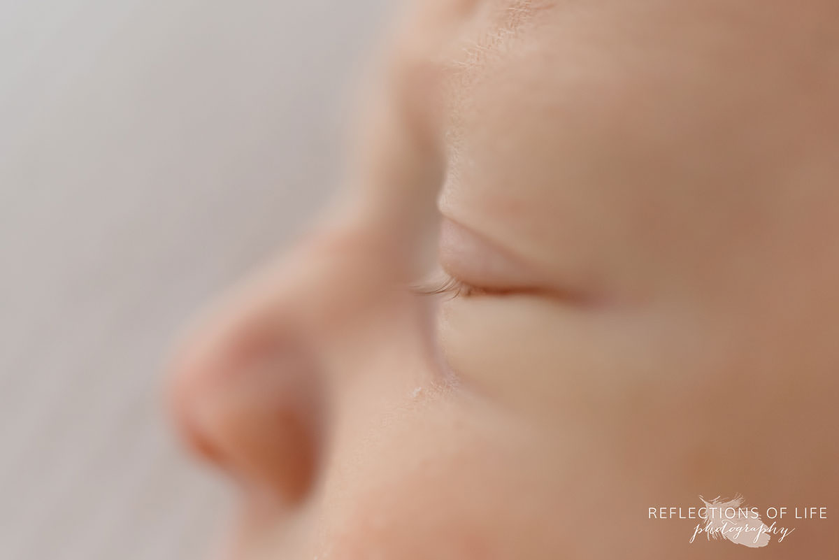 Newborn baby eyelashes in natural lgiht Grimsby Ontario studio.jpg