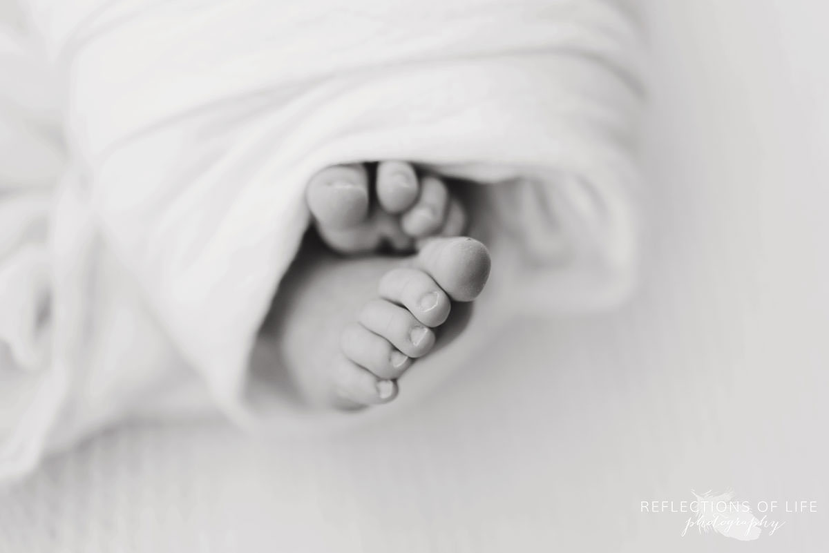 Newborn baby toes in black and white with macro lens.jpg